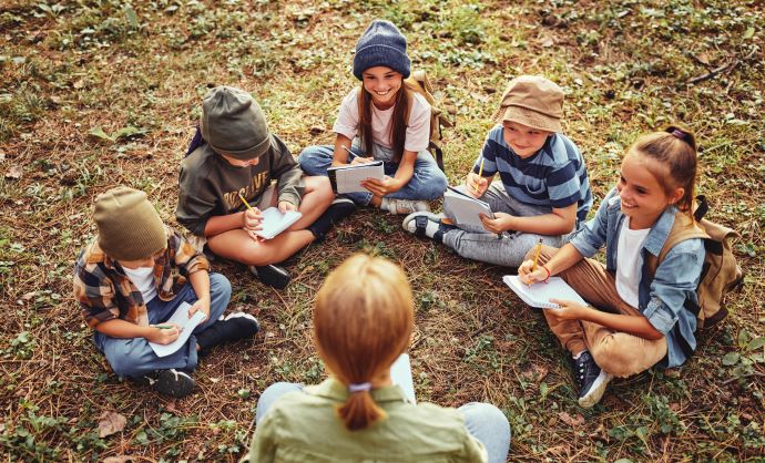 group of children sitting in a circle