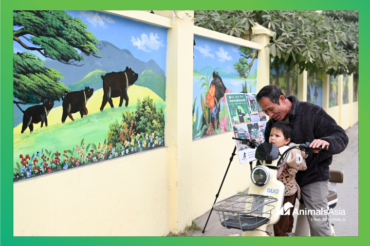 villagers in front of mural